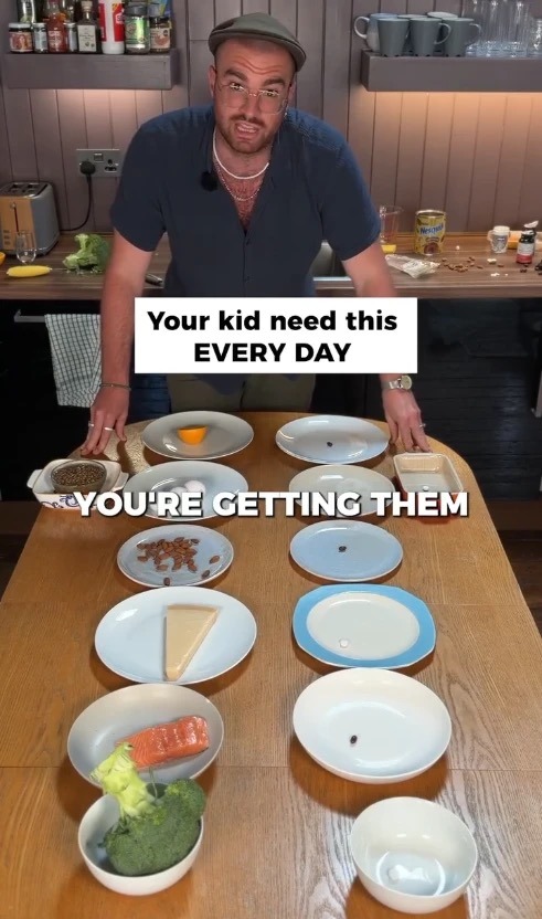 Still from the Bonjour ad: a presenter laying out the foods a child needs every day
